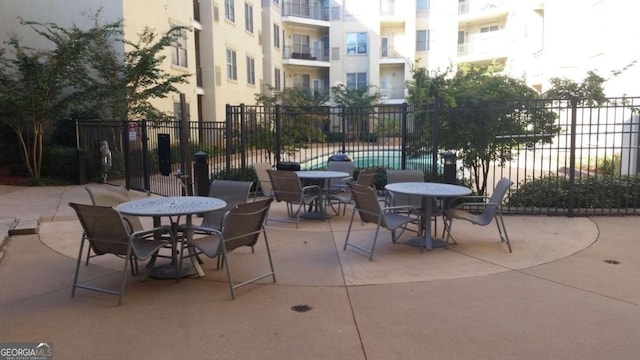 view of patio with a community pool