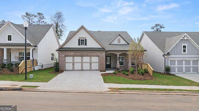 view of front of property with a porch, a garage, and a front yard