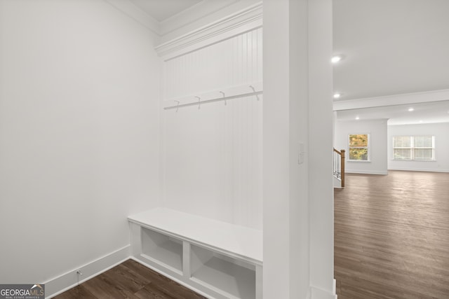 mudroom with wood-type flooring and ornamental molding