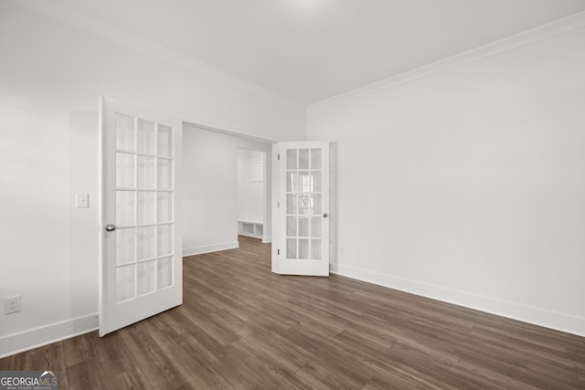 unfurnished room with dark hardwood / wood-style flooring, ornamental molding, and french doors