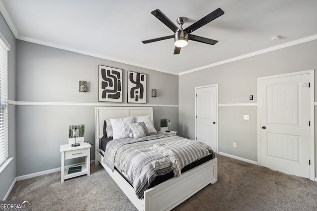 carpeted bedroom with ceiling fan and ornamental molding