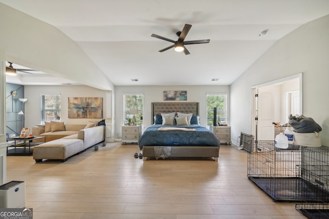 bedroom with multiple windows, lofted ceiling, and ceiling fan