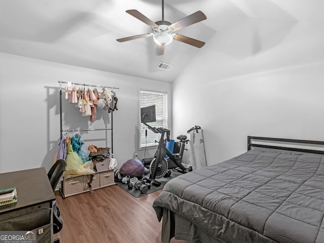 bedroom with hardwood / wood-style floors, ceiling fan, and lofted ceiling