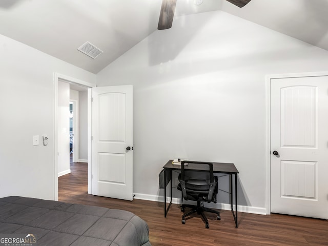 bedroom featuring dark wood-type flooring and vaulted ceiling