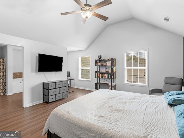 bedroom featuring ceiling fan, hardwood / wood-style floors, and lofted ceiling