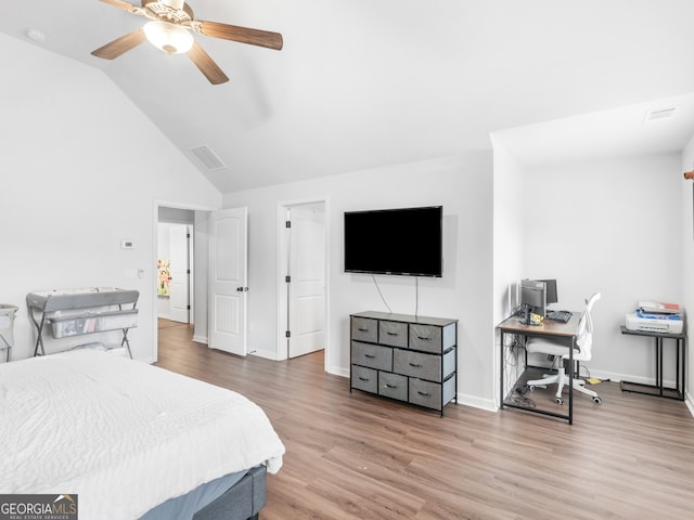 bedroom featuring hardwood / wood-style floors, ceiling fan, and lofted ceiling