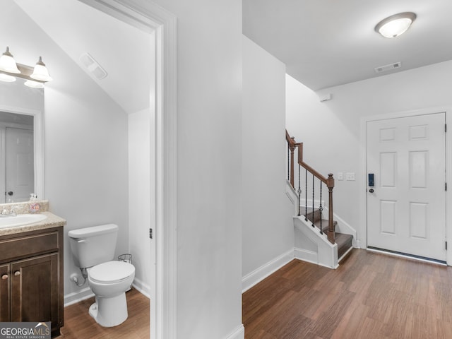 interior space with dark hardwood / wood-style flooring and sink