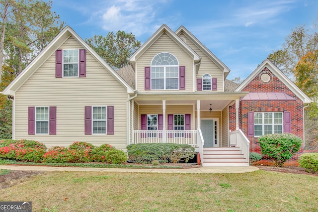 front facade featuring a porch and a front lawn