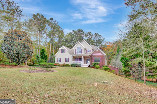 front facade with covered porch and a front lawn