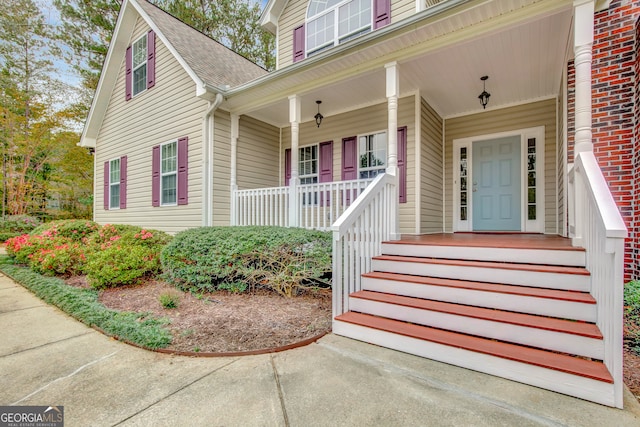 entrance to property with covered porch