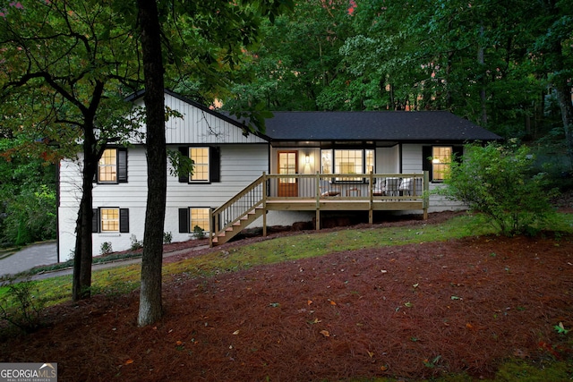 view of front of house with a wooden deck