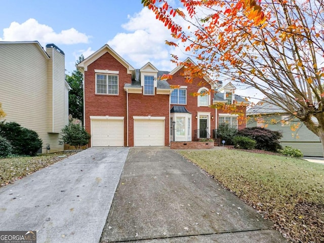 view of property with a front lawn and a garage