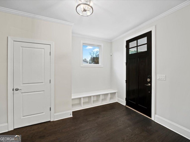 entrance foyer featuring ornamental molding and dark wood-type flooring