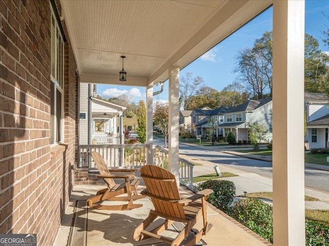 view of patio featuring a porch