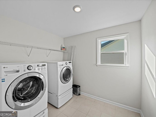 clothes washing area featuring washer and dryer