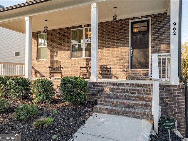 doorway to property with covered porch