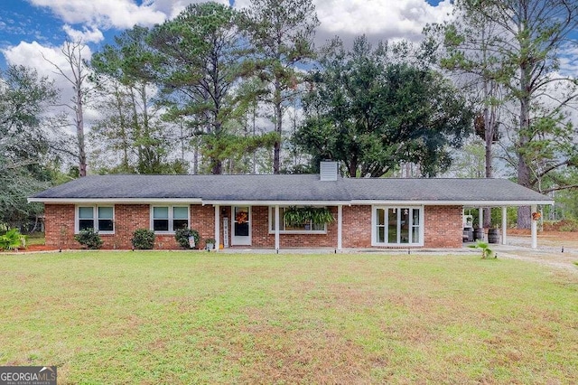 ranch-style home with a front lawn and a carport