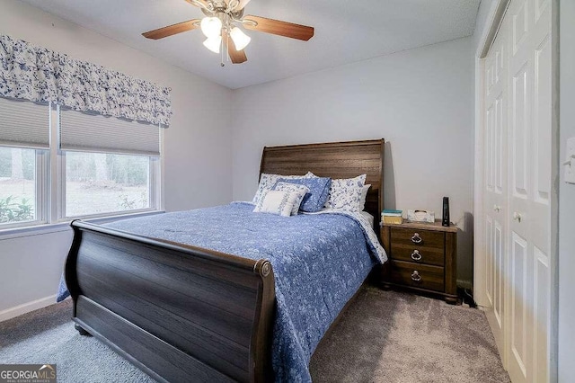 carpeted bedroom featuring a closet and ceiling fan