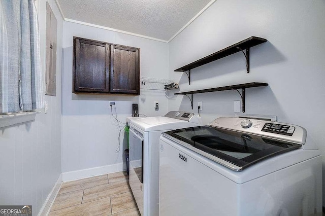 laundry area with separate washer and dryer, crown molding, cabinets, and a textured ceiling