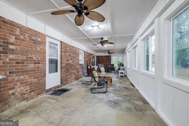 sunroom / solarium with ceiling fan