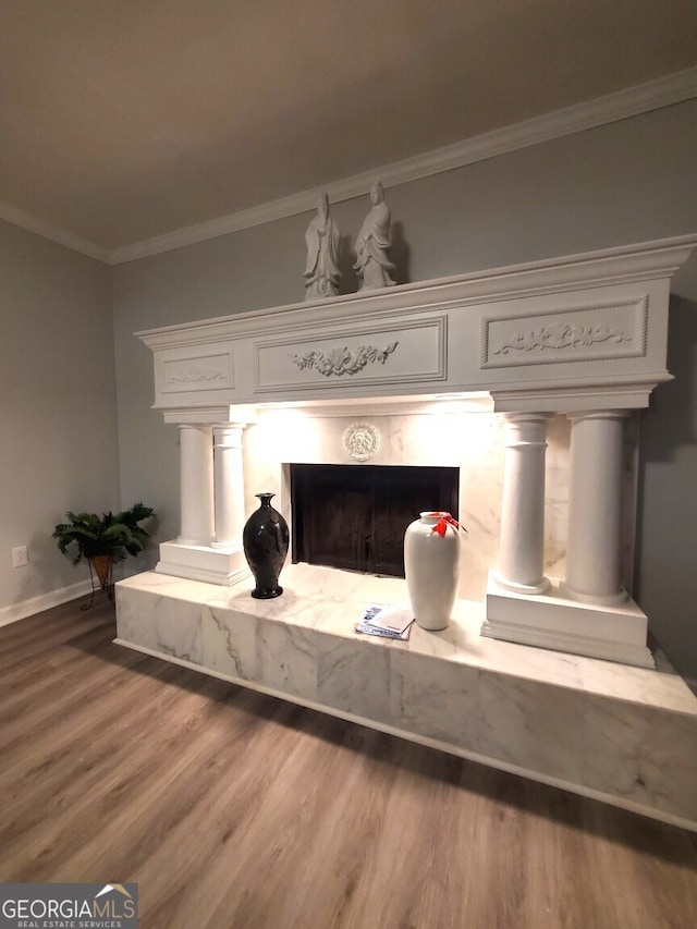 details with hardwood / wood-style flooring and crown molding