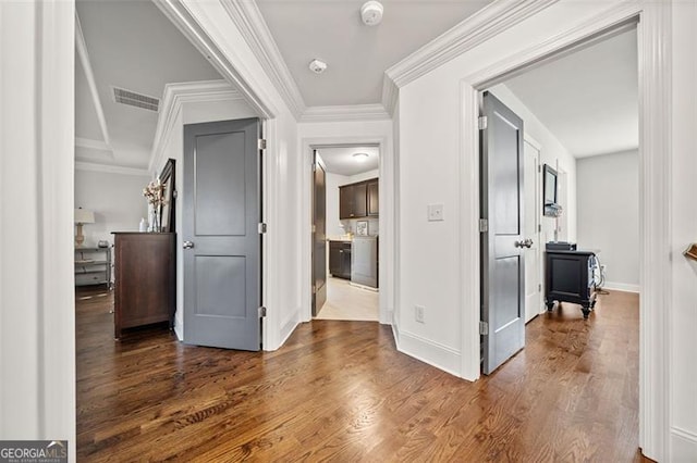 corridor with crown molding and dark hardwood / wood-style floors