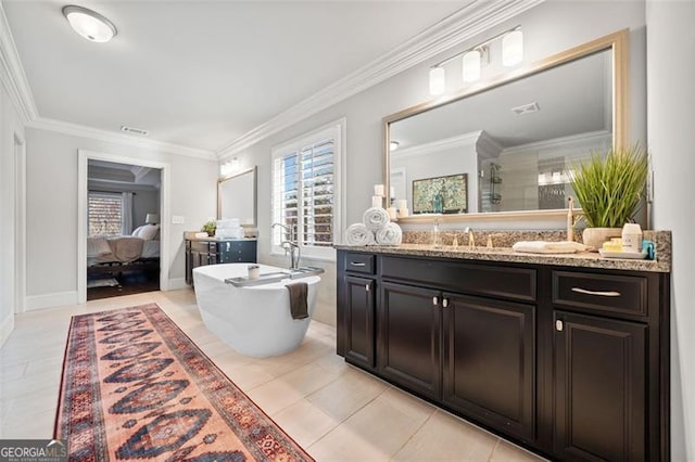 bathroom with a wealth of natural light, crown molding, vanity, and tile patterned flooring