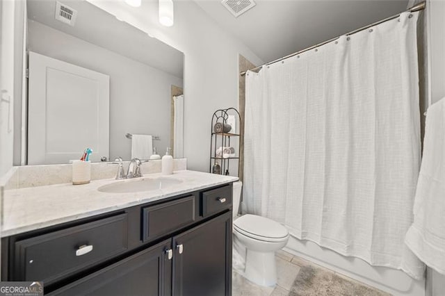 full bathroom with tile patterned floors, vanity, toilet, and shower / bath combo with shower curtain