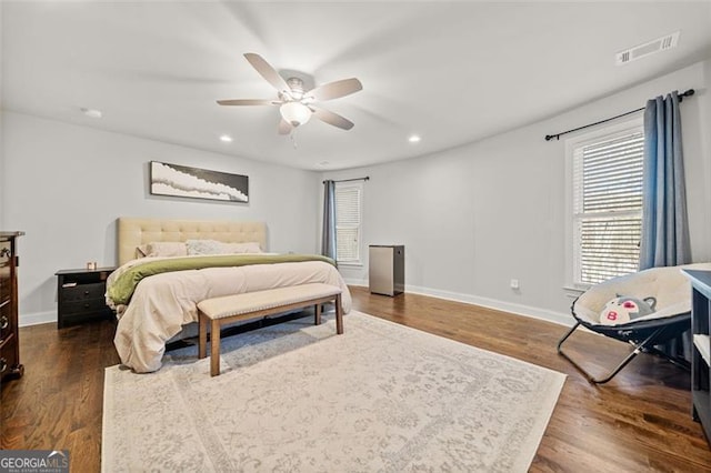 bedroom featuring ceiling fan and dark wood-type flooring