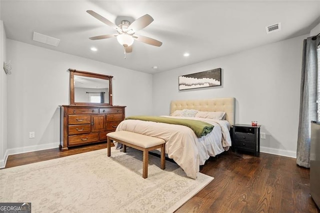 bedroom with ceiling fan and dark hardwood / wood-style floors