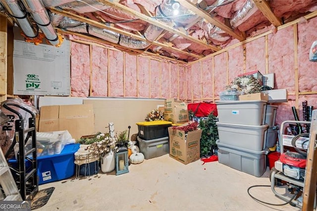 storage room featuring tankless water heater