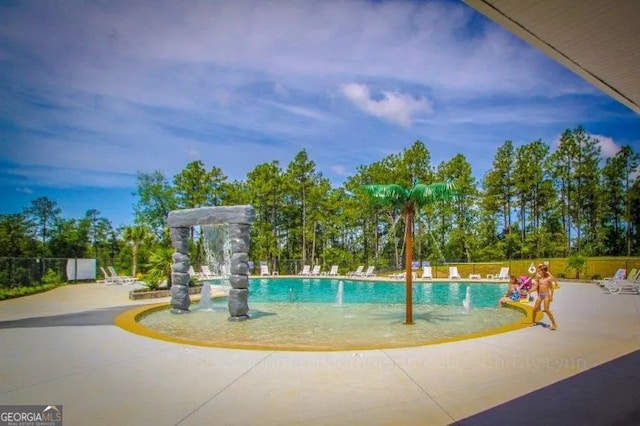 surrounding community featuring a patio and a pool