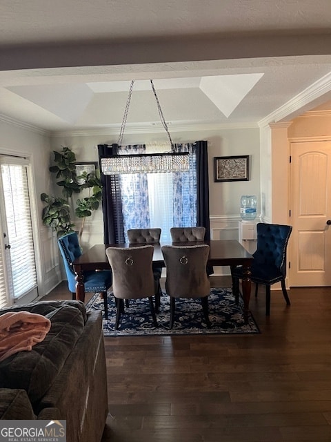 dining room with dark hardwood / wood-style flooring, french doors, crown molding, and a chandelier