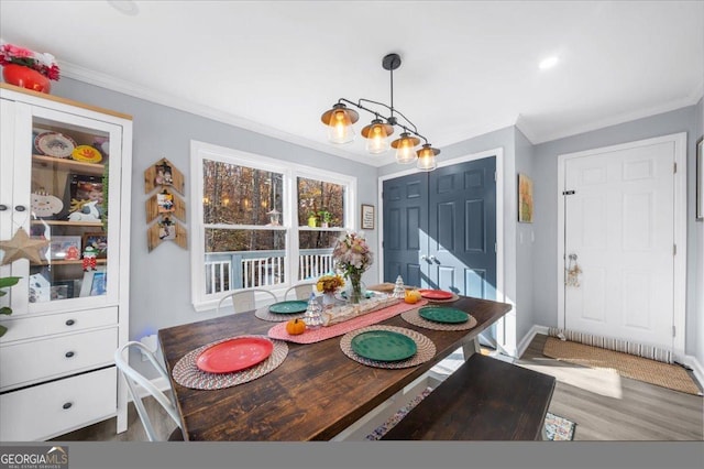 173 Mountainside Dr E, Dawsonville, GA 30534 - dining area with crown molding, wood finished floors, and baseboards