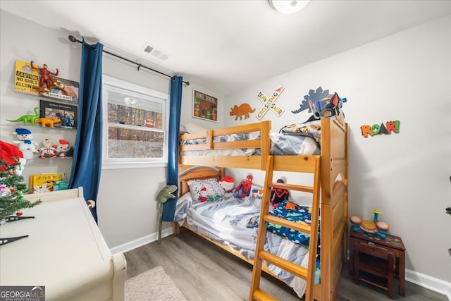 bedroom featuring hardwood / wood-style floors