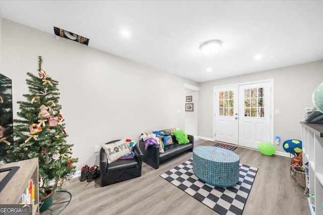 interior space featuring french doors and light wood-type flooring