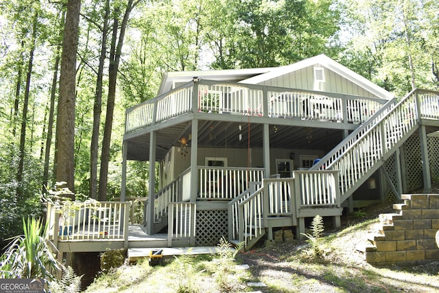 173 Mountainside Dr E, Dawsonville, GA 30534 - rear view of house with stairs and a deck