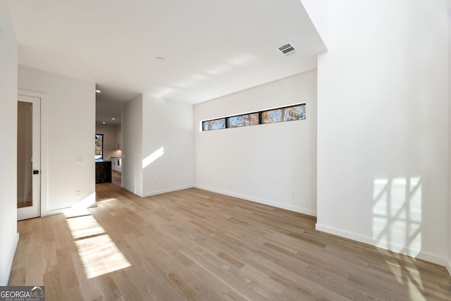 spare room with light wood-type flooring