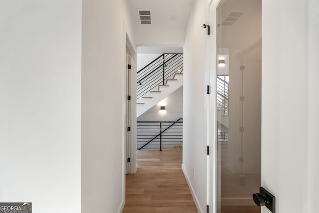 corridor featuring light wood-type flooring