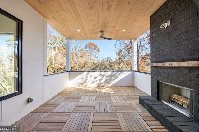 balcony with an outdoor brick fireplace