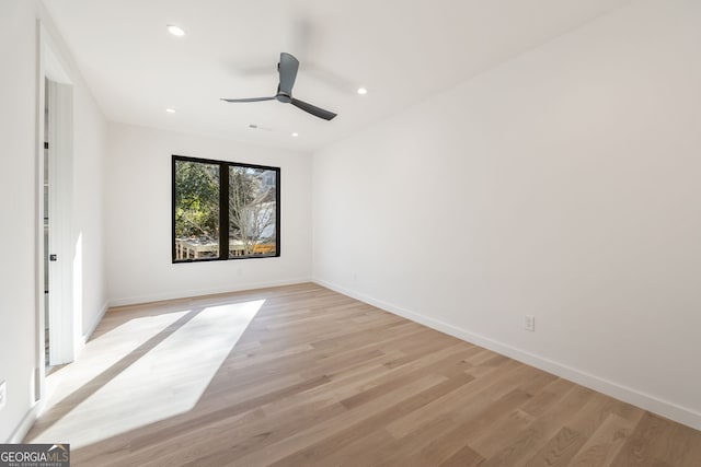 unfurnished bedroom with ceiling fan and light wood-type flooring