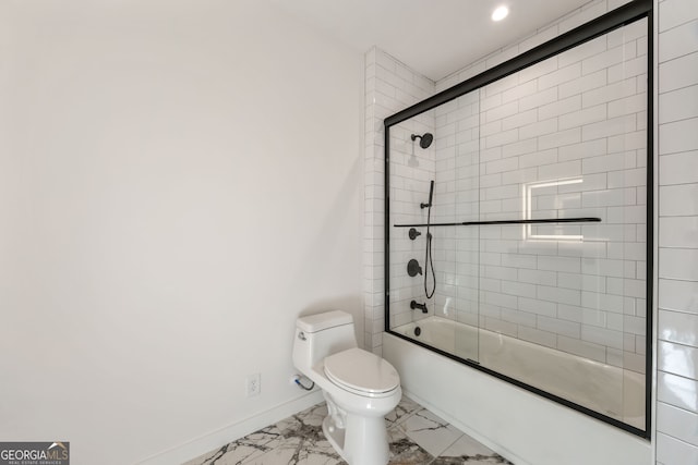 bathroom featuring toilet and combined bath / shower with glass door