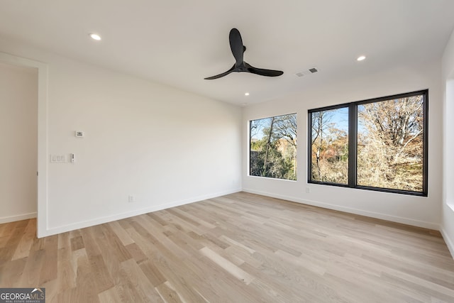 spare room with ceiling fan and light hardwood / wood-style floors