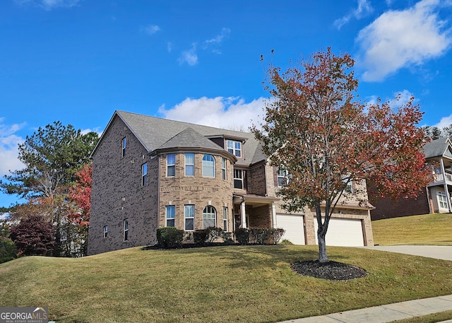 view of front facade featuring a garage and a front lawn