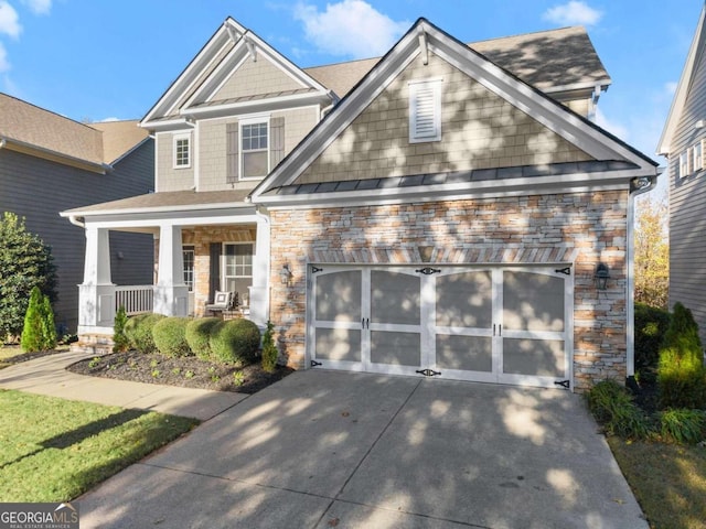 craftsman inspired home featuring covered porch