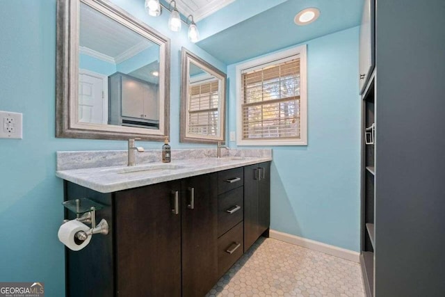 bathroom with vanity and crown molding