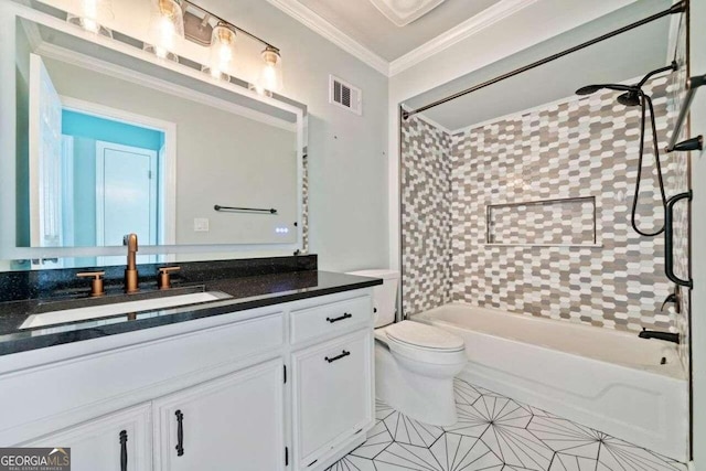 full bathroom featuring tile patterned floors, ornamental molding, tiled shower / bath combo, vanity, and toilet