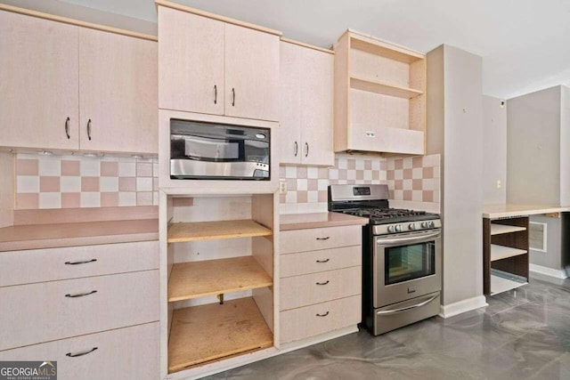 kitchen with backsplash and stainless steel gas range