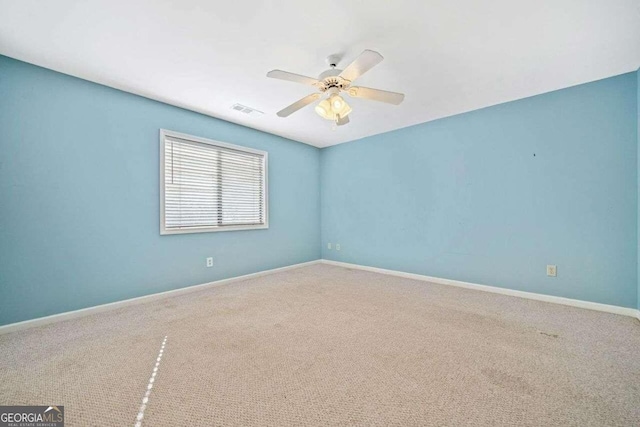 carpeted empty room with ceiling fan