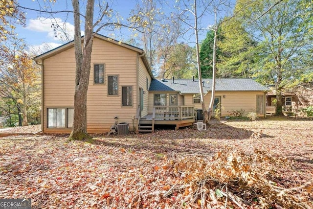 back of house featuring a deck